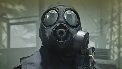Close-up of a gas-masked soldier from the official reveal footage